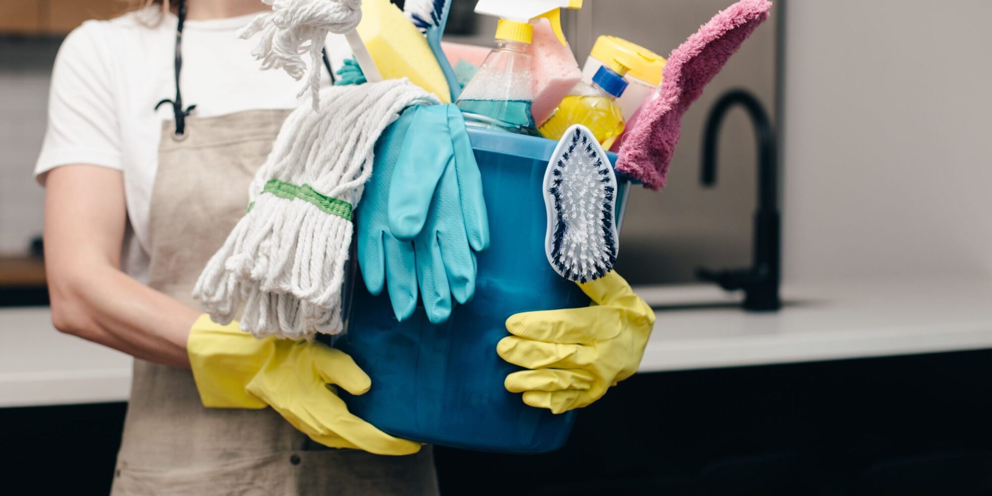 holding-bucket-of-cleaning-supplies